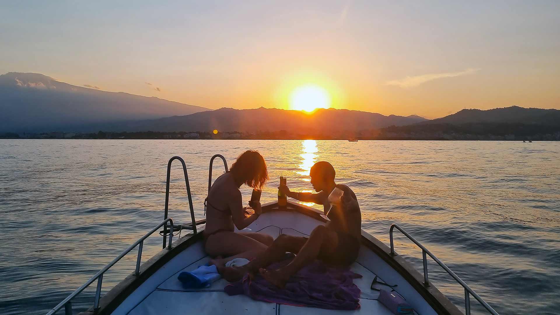 Tramonto in barca a Taormina